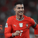 Cristiano Ronaldo merayakan gol bersama timnas Portugal dalam pertandingan internasional, mengenakan jersey merah Portugal